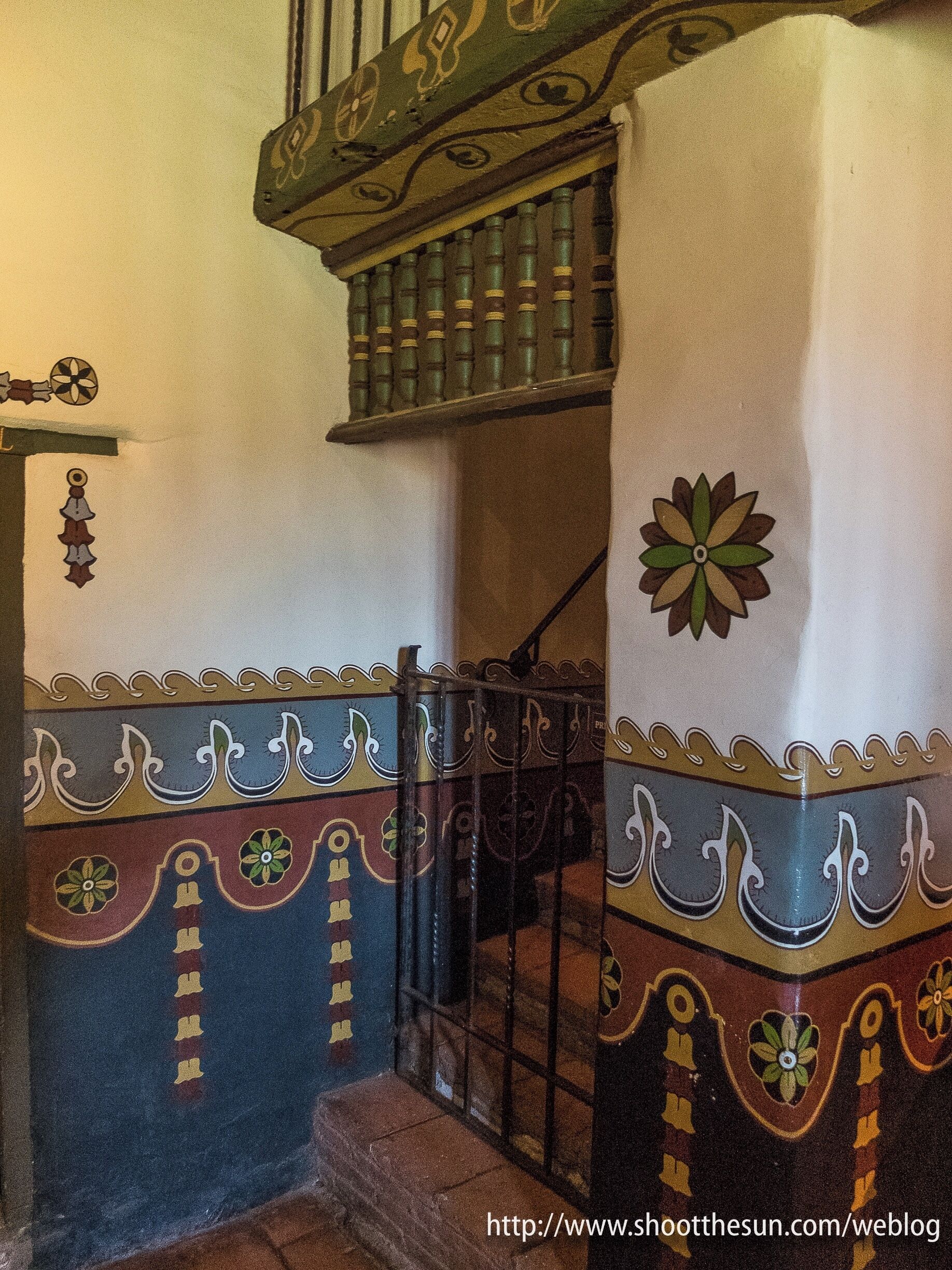 These painted details appear all through the chapel along the edges of the walls and lining the ceiling.  With all the beauty that surrounds them, it is difficult to realize just how inventive and colorful they really are.  I thought I'd give you a look at an area where they actually come to the foreground just to see how remarkable they are.

Whew, I've posted a lot of pictures from the chapel this evening.  Please indulge me, the place is just too extraordinary to pass by in a hurry.

Tomorrow we move back out onto the grounds and investigate a few of the other exhibits at the mission.  Among them will be a couple of museums (because that is really all you can call them), one devoted to the liturgical art from the mission's past, and one dedicated to the Native Americans who lived in the area.