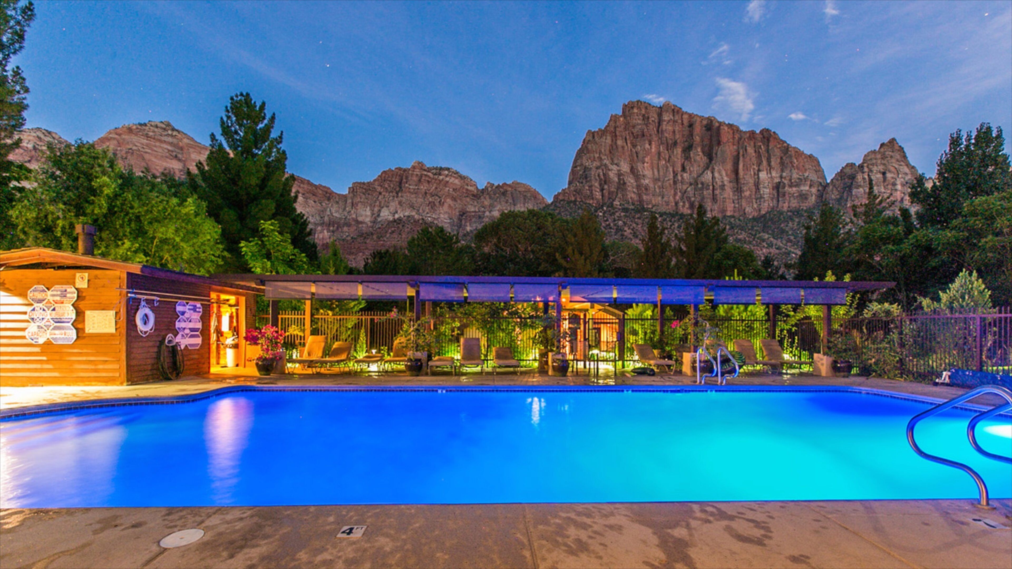 Springdale which includes a pool, night scenes and a gorge or canyon