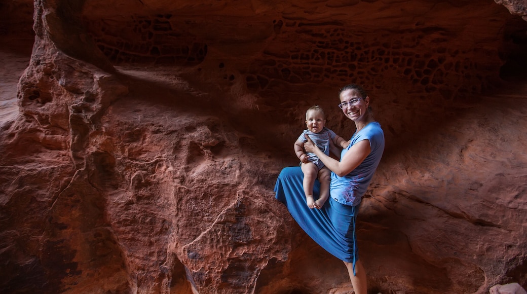 Mother and son on a trail in volcanic Snow canyon State Park in Utah, USA