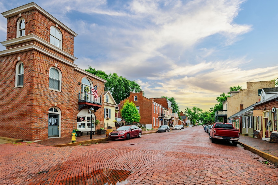 The historic 18th century Main Street through the brick paved old town of St. Charles, Missouri, along the Missouri River.