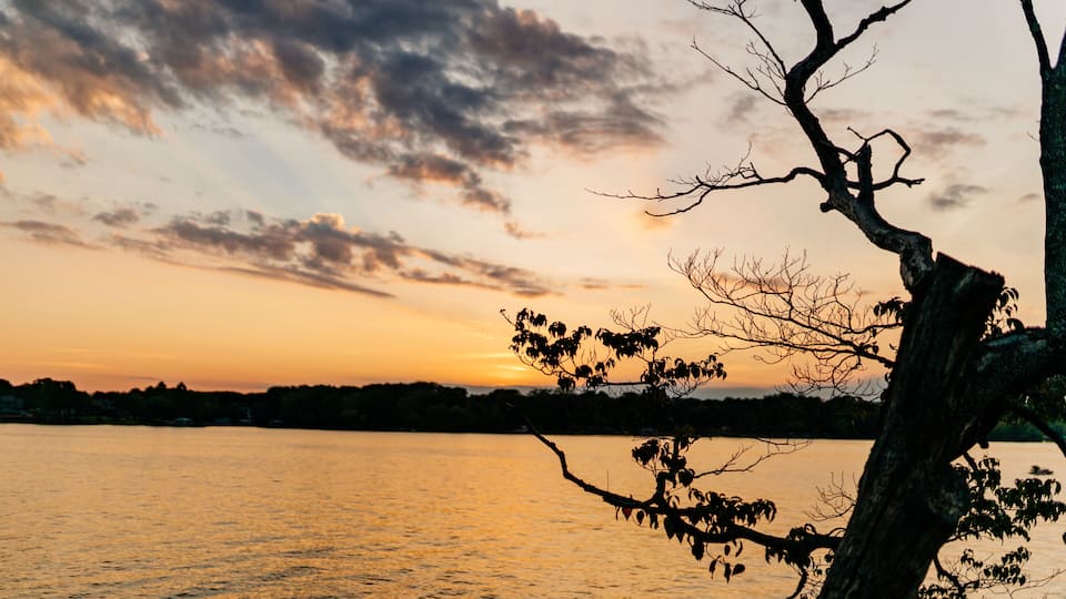 Beautiful sky and lake at sunset. Beautiful orange and blue sky at dawn. Lake Bowen Anchor Park, Inman, SC, USA