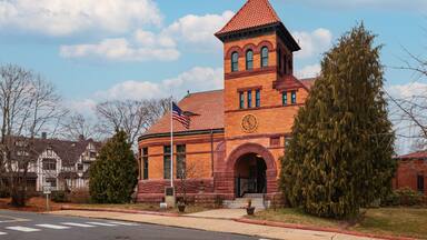 The old part of the Plumb Memorial Library in Shelton, CT is recognizable for its unique Romanesque architecture