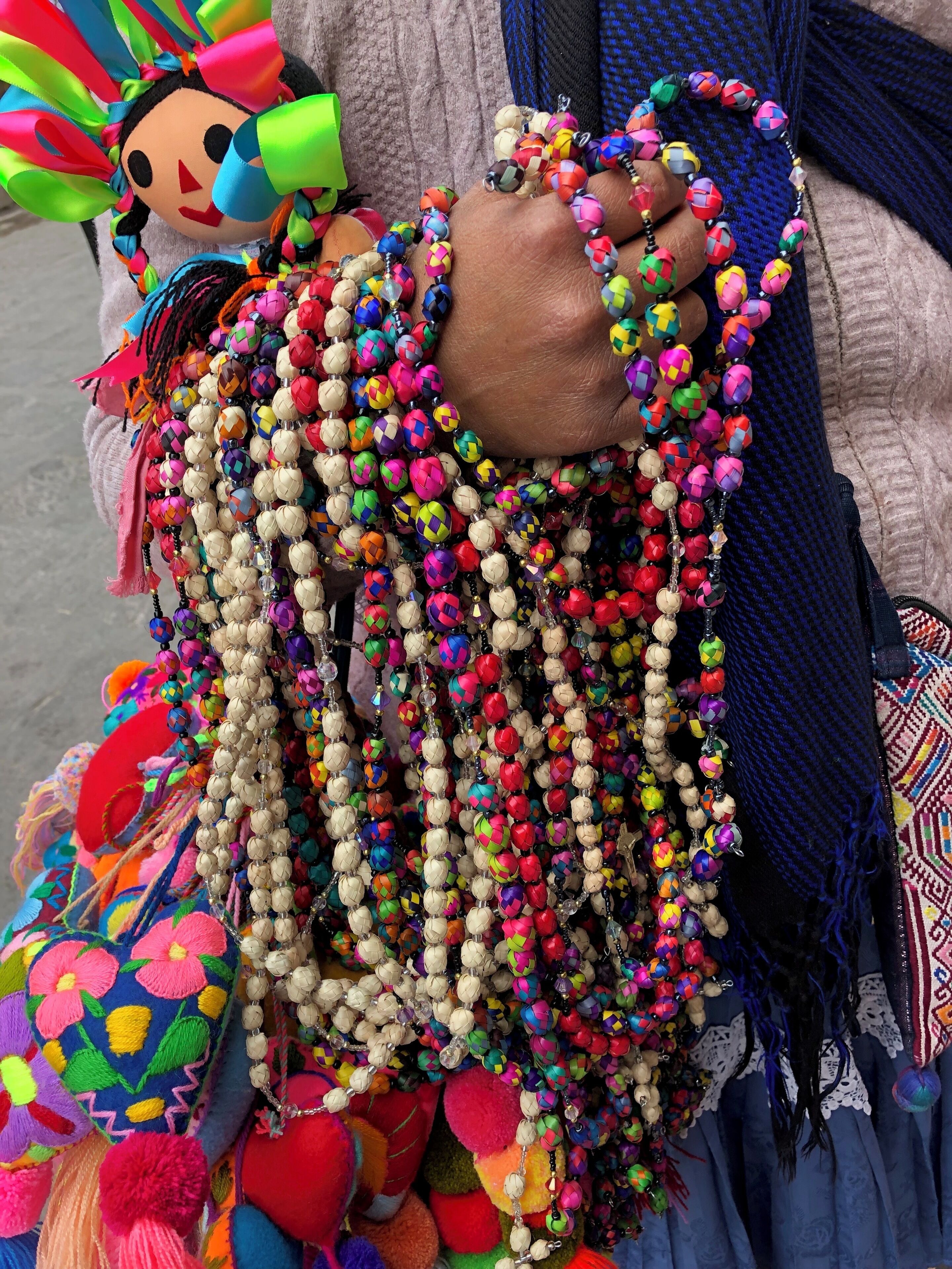 Ladies walk around the city selling handmade necklaces, dolls and trinkets. The colors are just so beautiful. 