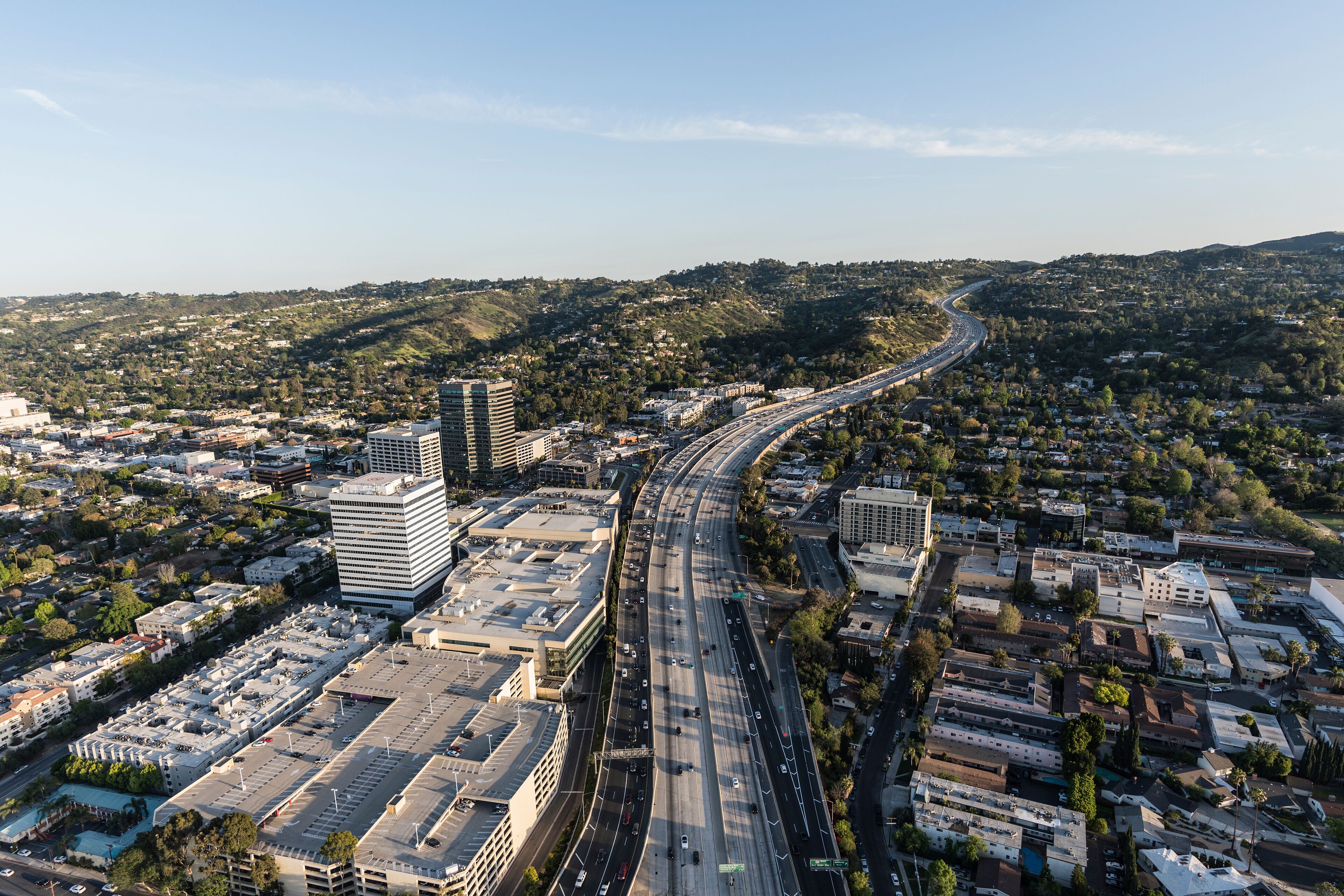 Late afternoon aerial view of San Diego 405 Freeway near Ventura Blvd in the San Fernando Valley area of Los Angeles, California.