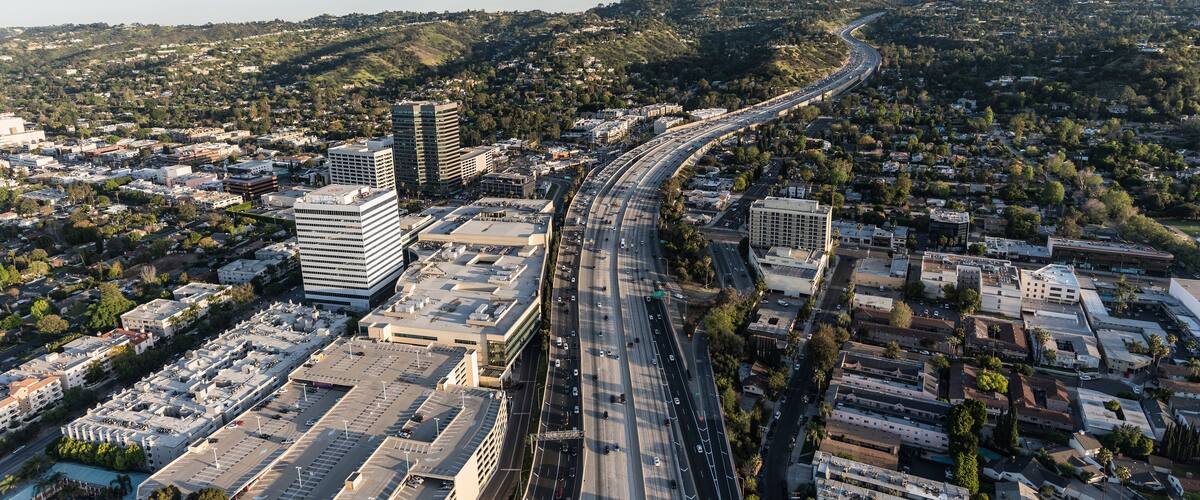 Late afternoon aerial view of San Diego 405 Freeway near Ventura Blvd in the San Fernando Valley area of Los Angeles, California.