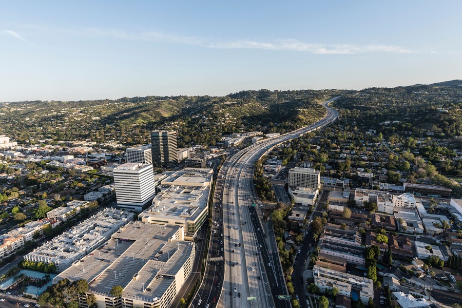Late afternoon aerial view of San Diego 405 Freeway near Ventura Blvd in the San Fernando Valley area of Los Angeles, California.