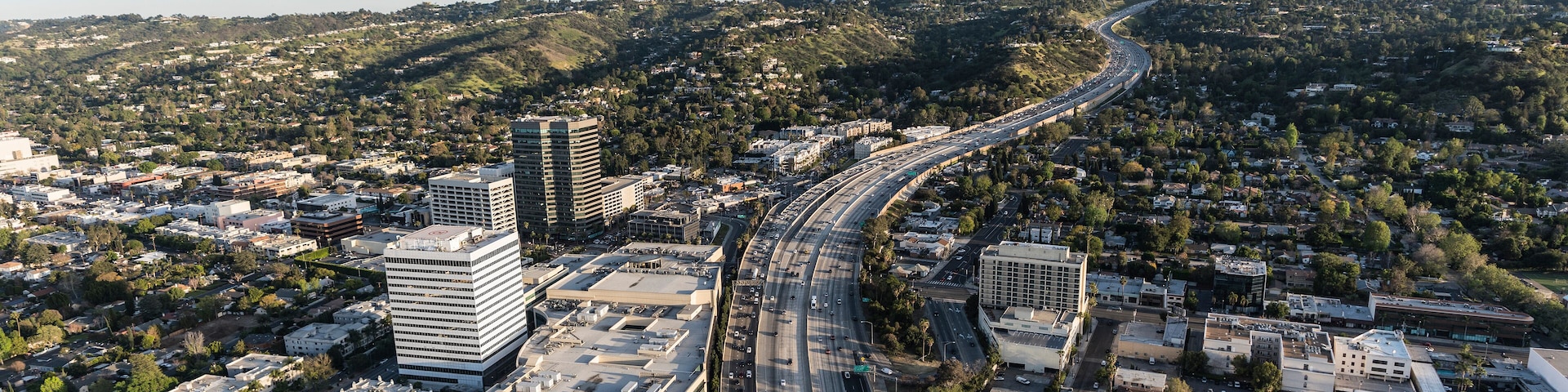 Late afternoon aerial view of San Diego 405 Freeway near Ventura Blvd in the San Fernando Valley area of Los Angeles, California.
