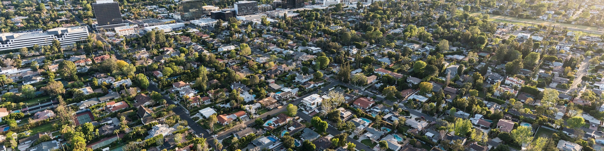 Late afternoon aerial view of Sherman Oaks and Encino in the San Fernando Valley area of Los Angeles, California.
