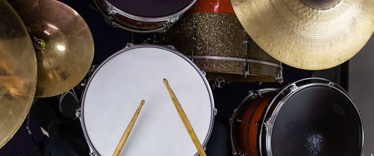 A close-up of a drum set with cymbals and drums.