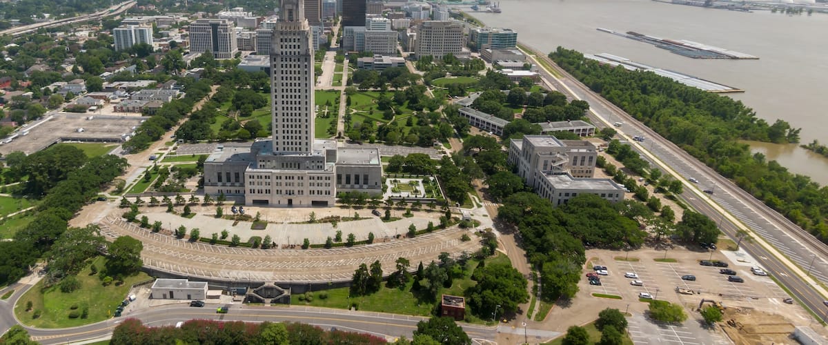 Louisiana State Capitol building and downtown city skyline of Baton Rouge, Louisiana, USA.