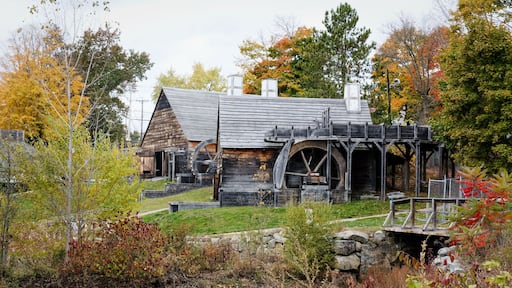 The Saugus Iron Works Forge and Slitting Mill surrounded by colorful fall foliage - landscape