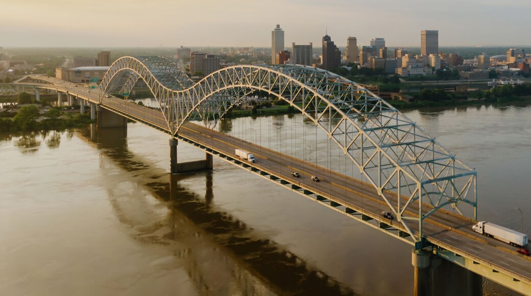 Hernando de Soto Bridge crossing the Mississippi River at sunrise. In the background is downtown Memphis, Tennessee, United States.