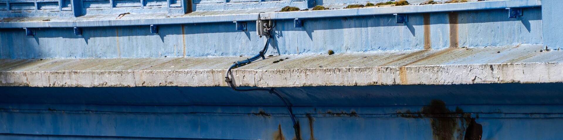 Close up detail of blue iron bridge structure in Dublin
