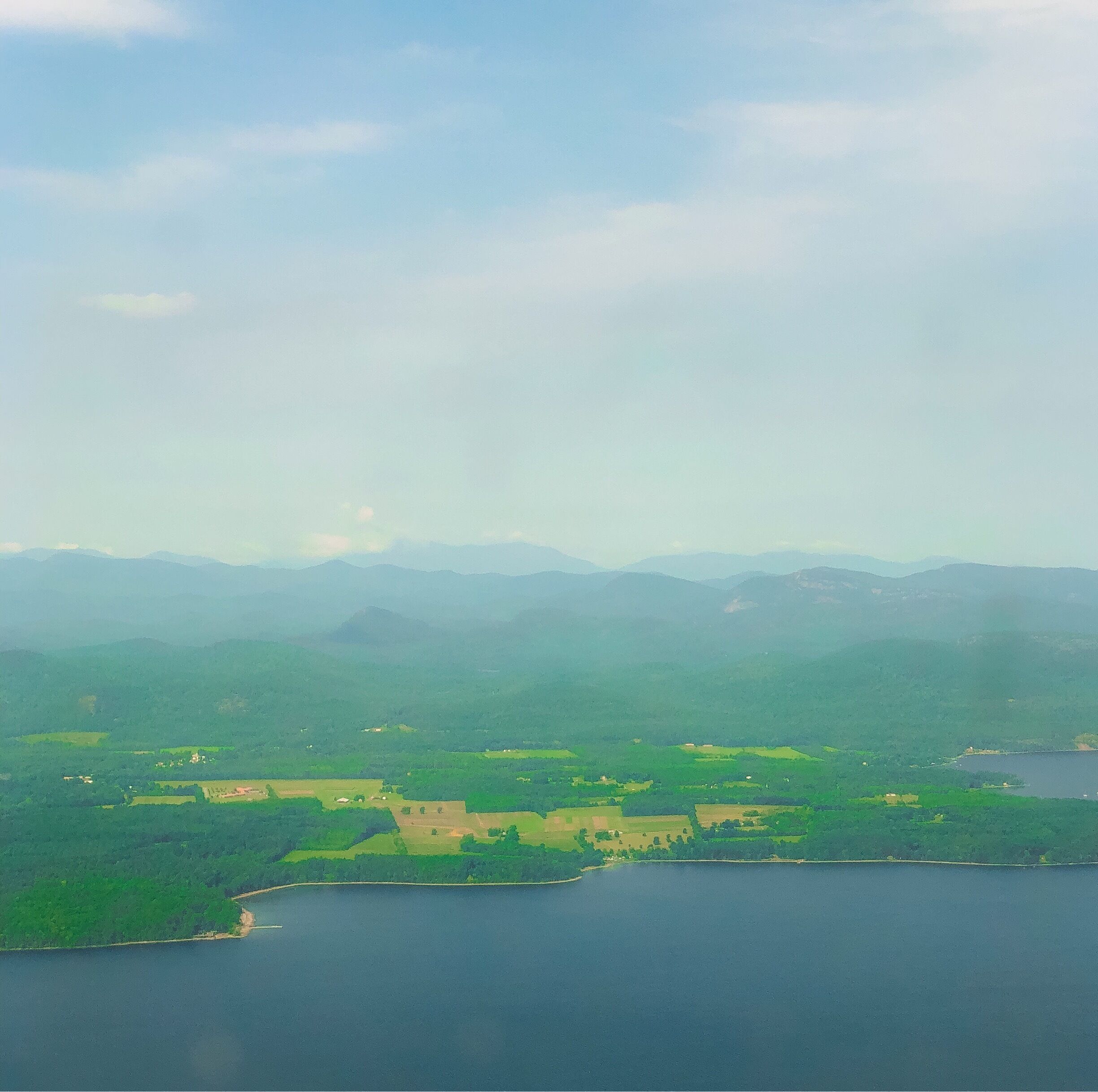 If you ever get the opportunity to visit Burlington Vermont some of the best sights are from above. The rolling mountains and landscapes are breathtaking, like Vermont! This is above Lake Champlain. #aboveitall