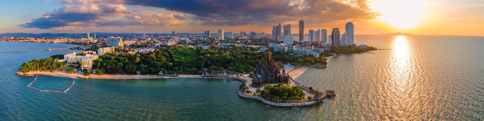 Skyline of Pattaya city with The Sanctuary of Truth wooden temple in Pattaya Thailand