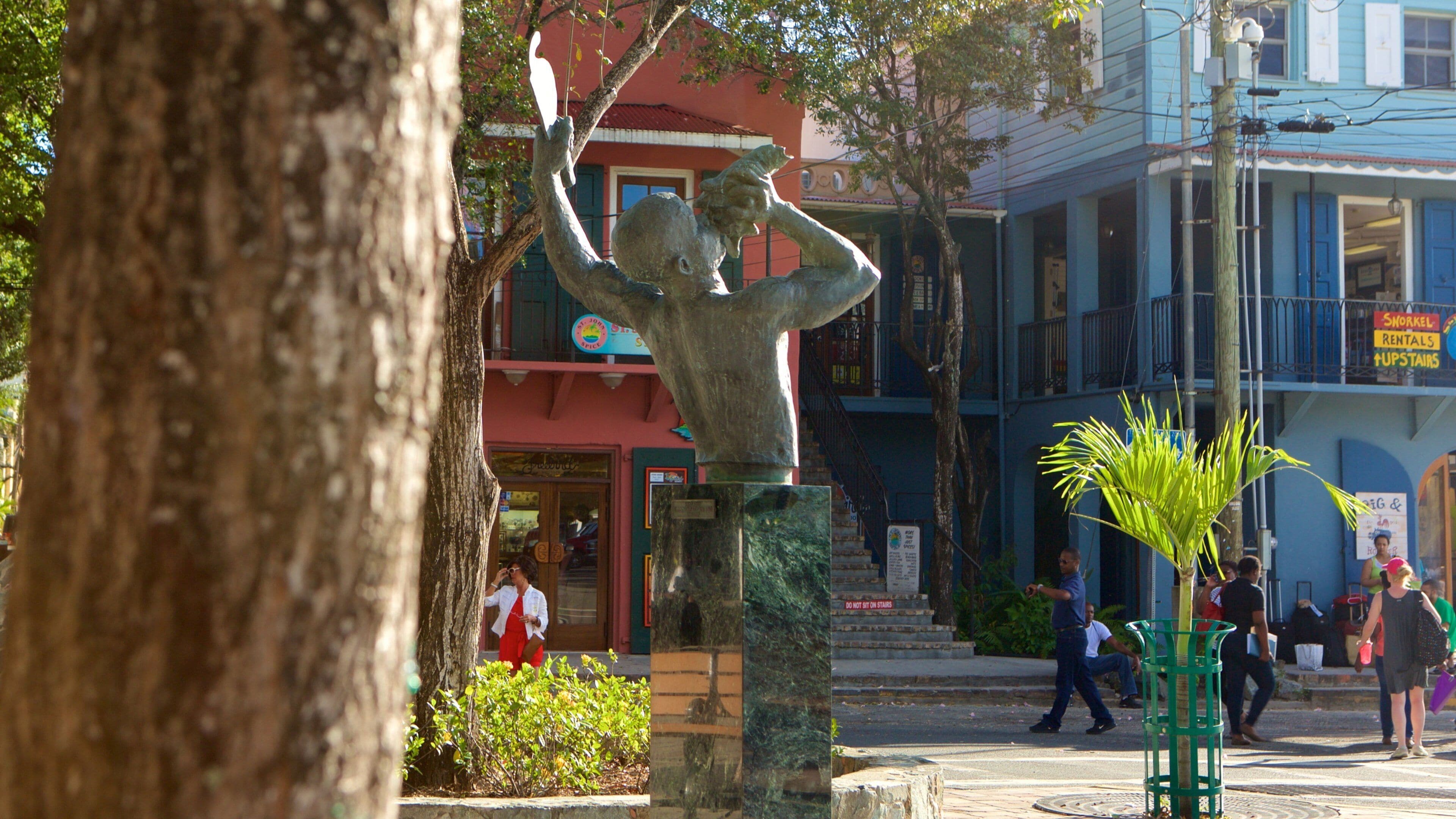 Cruz Bay which includes a small town or village and a statue or sculpture