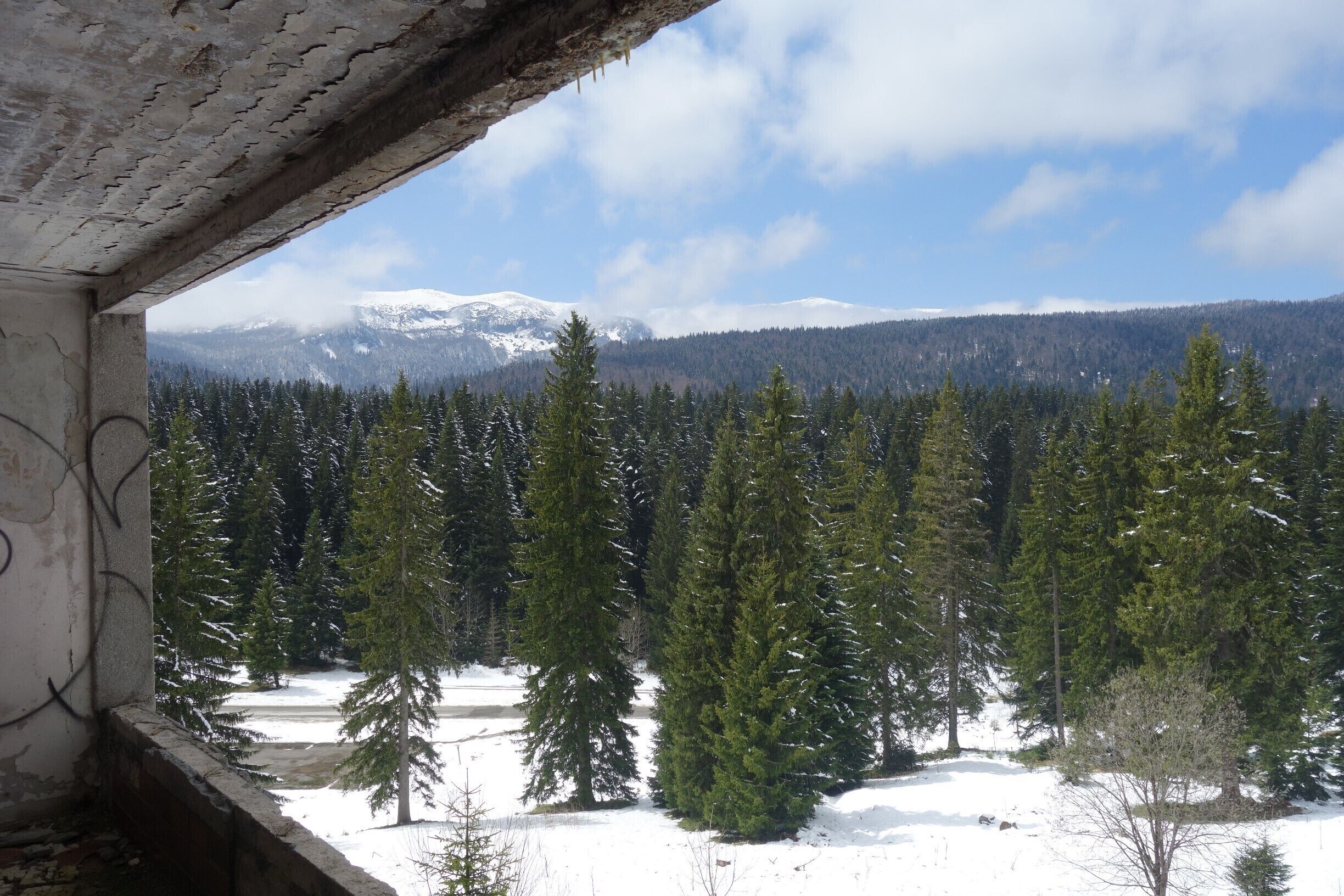 View of the surrounding landscape, photo taken in one of the vandalized rooms of Hotel Igman.   #abandoned 