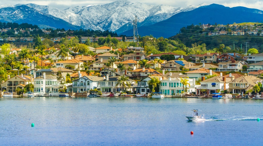 Lake Mission Viejo with snow capped Santa Ana Mountains in the distance, after epic snowstorm in Southern California