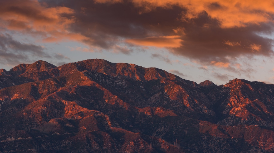 A view of the San Gabriel Mountains and clouds taken from Pasadena, shown at sunset.