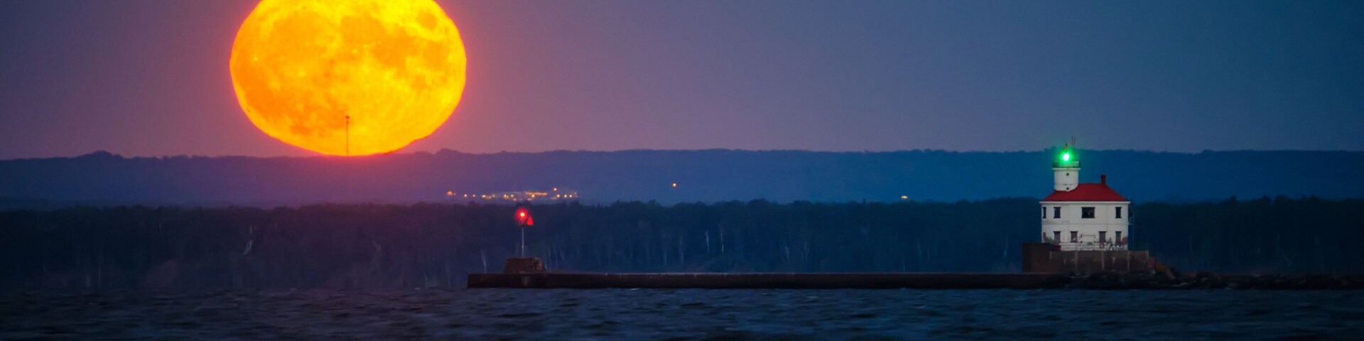 Moonrise behind Superior Entry Lighthouse on Lake Superior.