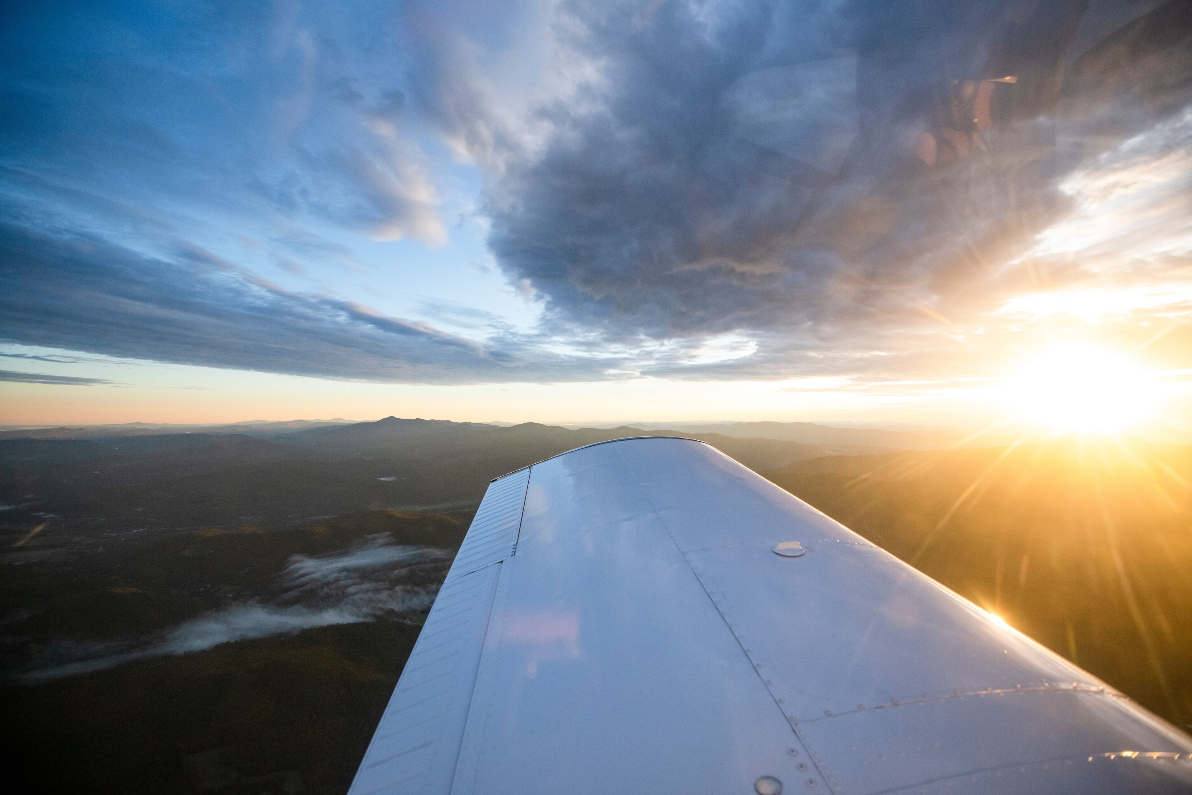 Sunrise flight over Vermont as seen by small airplane