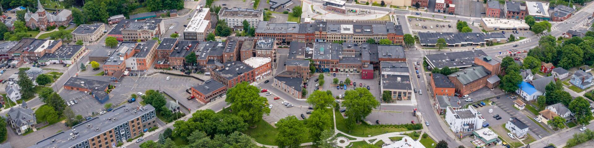 Oneonta, NY, USA - June 7, 2026: Late afternoon spring aerial photo of downtown, business district, Oneonta, NY on an overcast day.