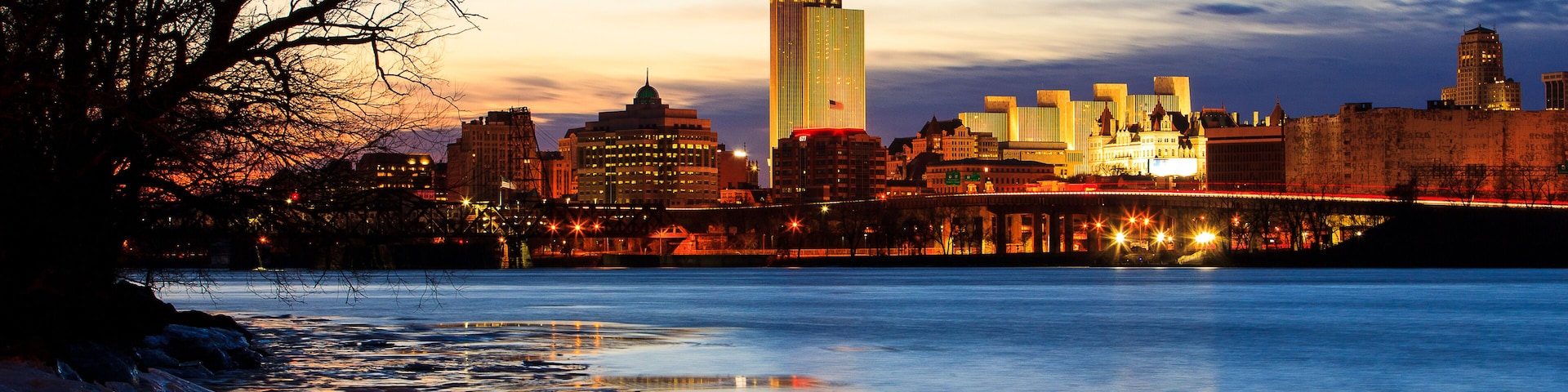 Albany NY skyline at night reflections off the Hudson River