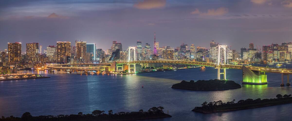 Panoramic View of the Rainbow Bridge crossing northern Tokyo Bay between Shibaura Pier and the Odaiba waterfront development in Minato, Tokyo, Kanto region, Japan.
