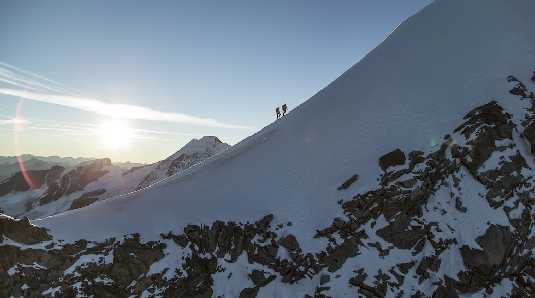 St. Moritz featuring a sunset, hiking or walking and snow