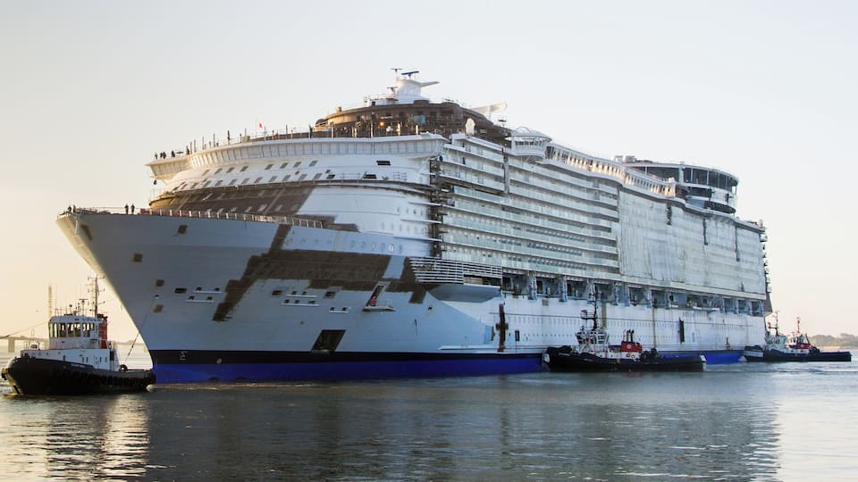 A large cruise ship docked at a port.
