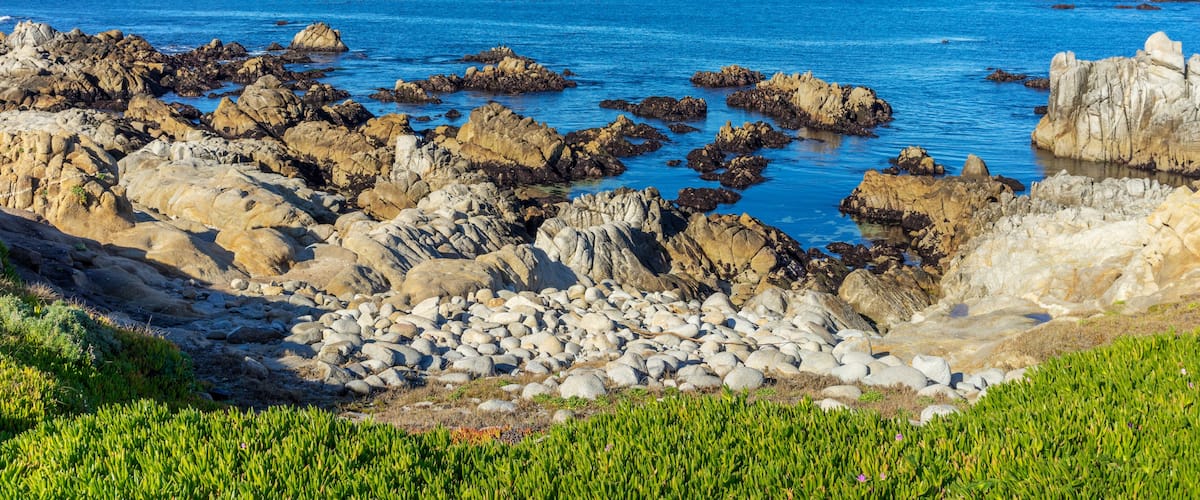 Rock formation and ocean water on the shoreline of Monterey Bay