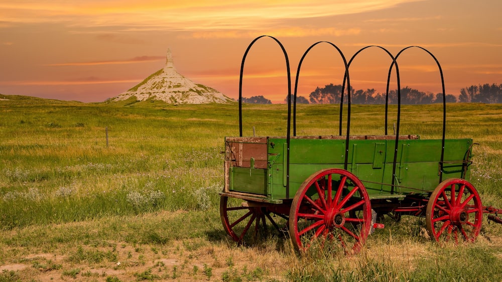chimney rock national historic site. It is a prominent geological rock formation in western Nebraska, rising nearly 300 feet above the surrounding North Platte River valley