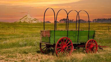 chimney rock national historic site. It is a prominent geological rock formation in western Nebraska, rising nearly 300 feet above the surrounding North Platte River valley