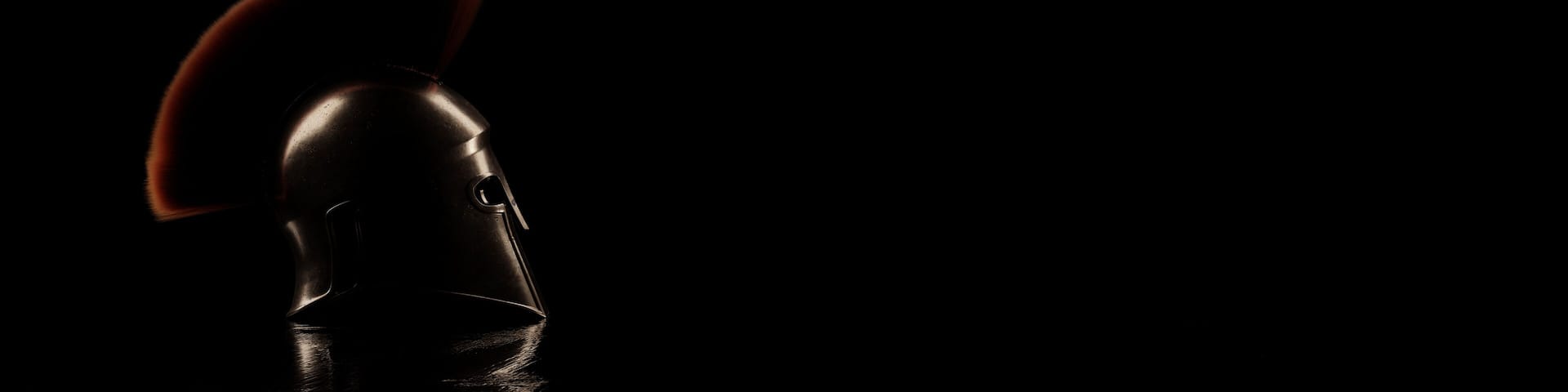 Ancient greek Sparta helmet from side view in low key light. 3D Rendering