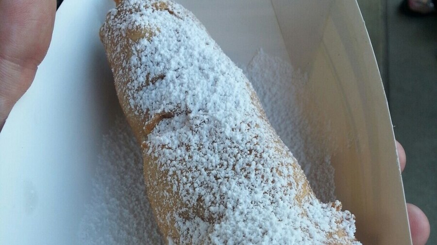 Funnel dog - a funnel cake wrapped hot dog creation. Available at Arvest ballpark.