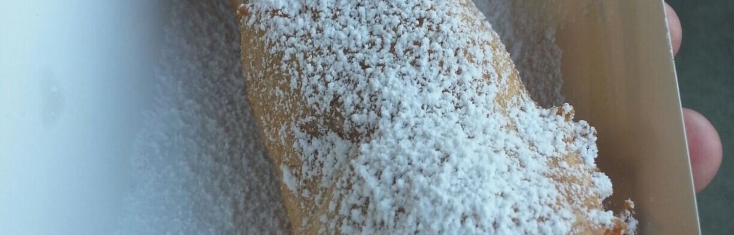 Funnel dog - a funnel cake wrapped hot dog creation. Available at Arvest ballpark.