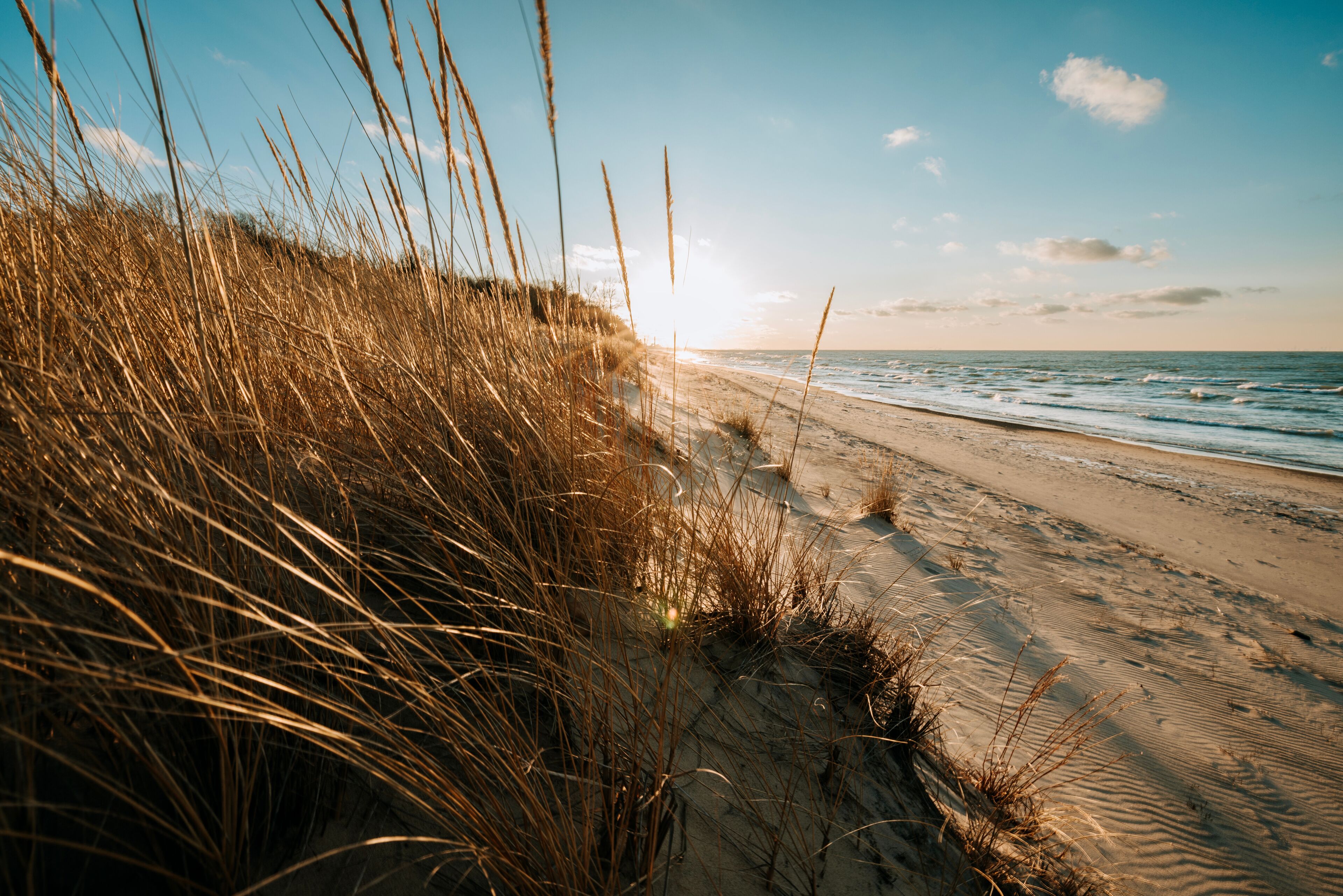 Sun sets over a beach on Lake Michigan in Indiana Dunes National Park