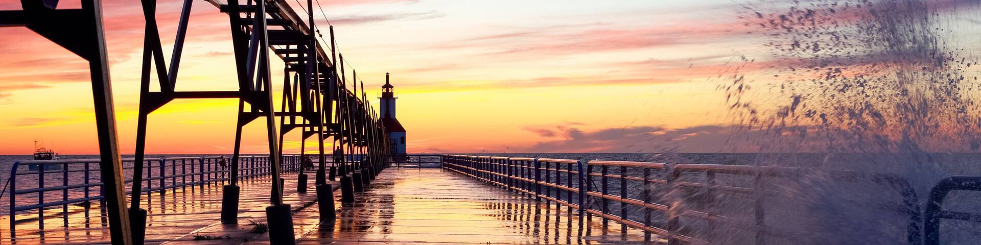 Lighthouse in Saint Joseph Michigan on a wavy summer evening at sunset