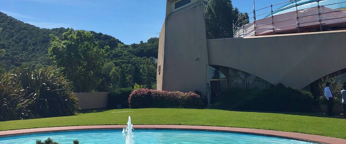 Spire and fountain which are located in an outdoor space that is off the employee cafeteria area.