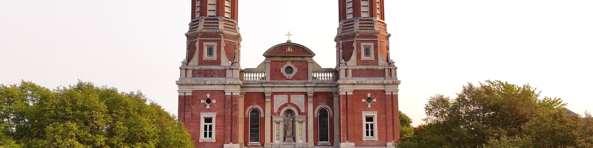 Shrine of St. Joseph Catholic Cathedral Church in Downtown Saint Louis, Missouri with green trees.