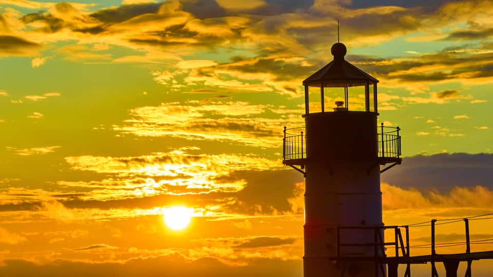 Aerial Tilt of Golden Hour Sunset Over St. Joseph Lighthouse