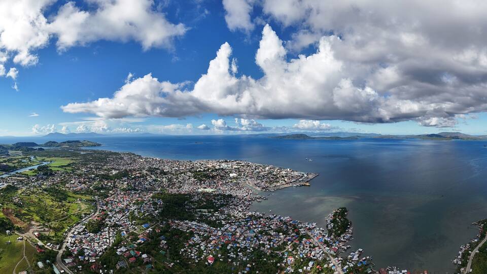 Panoramic view over Surigao City and Surigao Strait towards the island of Dinagat.