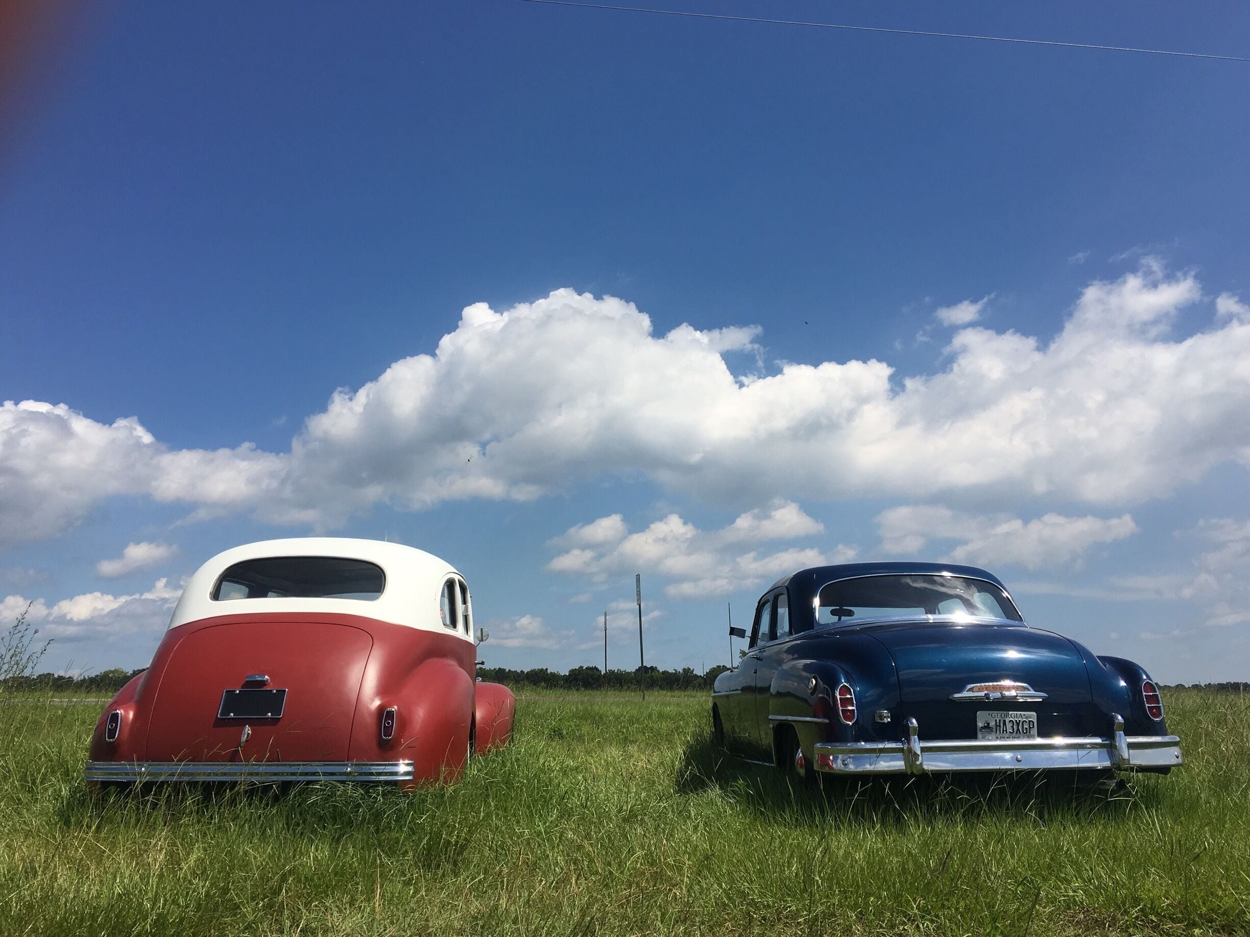 classic cars along the roadside