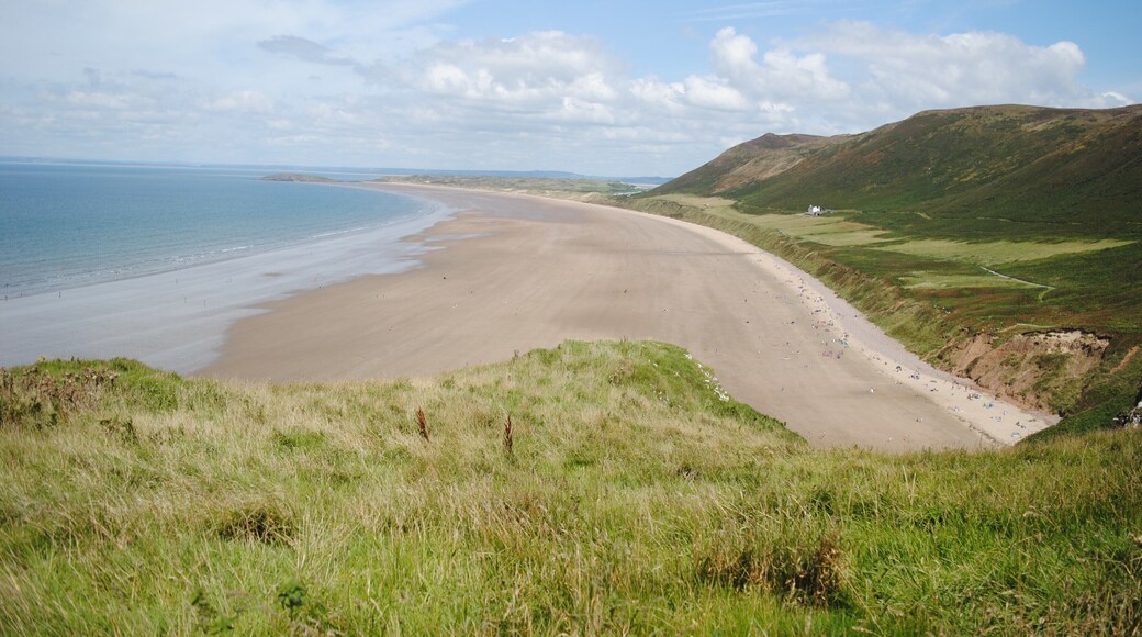 Rhossili is located at the most Western part of the Gower Peninsula. The most photographed part of Gower, The Worms Head, stretches out to sea and becomes an island when the tide comes in. The breathtaking view is completed by the long sandy beach and the towering cliffs and this makes it a popular destination throughout the year with surfers, paragliders and ramblers. However, Rhossili still manages to maintain its tranquility and unspoilt beauty.
#BeachTips