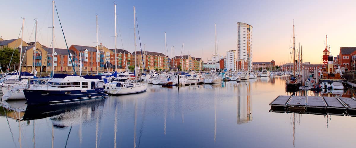 Swansea which includes general coastal views, a sunset and a marina