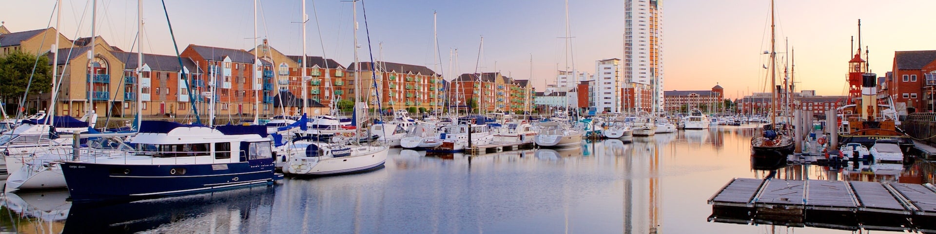 Swansea which includes general coastal views, a sunset and a marina