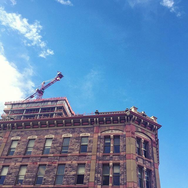 #downtown #denver #colorado ...a #crane pulling up a new #building behind #historic #larimersquare #historicpreservation #milehighcity ... The #city is growing so fast! #architecture