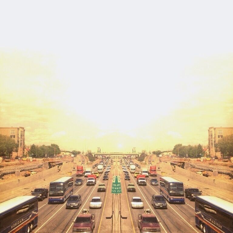 Take a gander at I-25's traffic and be glad you're not in it from the footbridge that connects Lodo to The Highlands. Symmetry not included. ;)