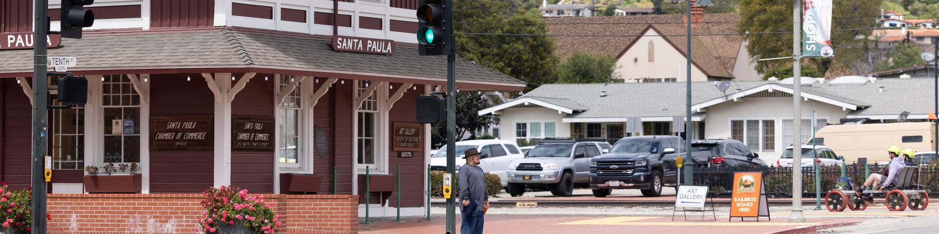 Cloudy afternoon sun shines on historic buildings in the heart of downtown Santa Paula, California, USA.