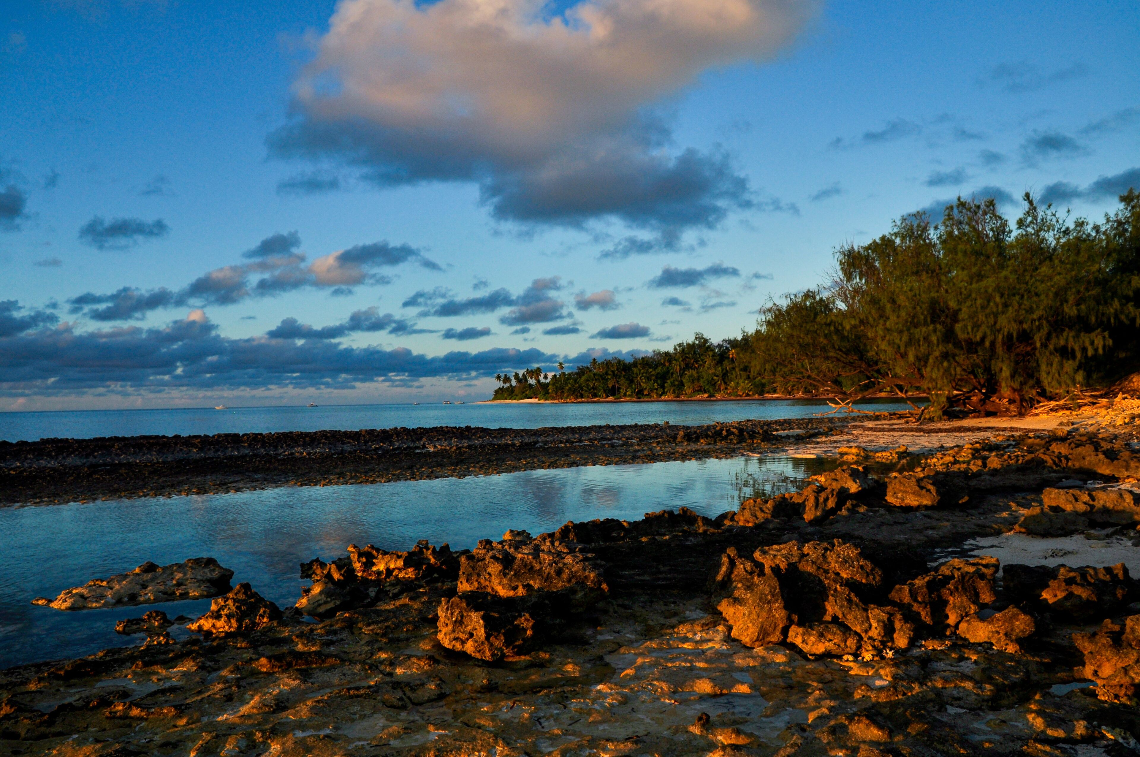 Remote tropical beach on the sunset with rocks on the Desroches Island, Seychelles
